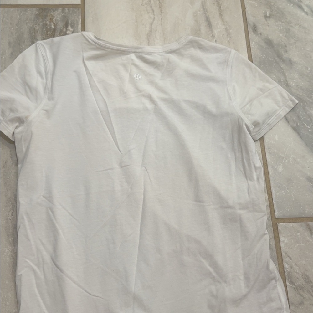 Lululemon bundle, two shirts, one white, one light pink